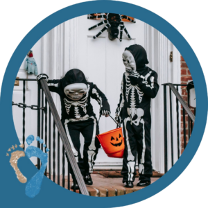 Halloween trick-or-treating foot safety on an autumn sidewalk